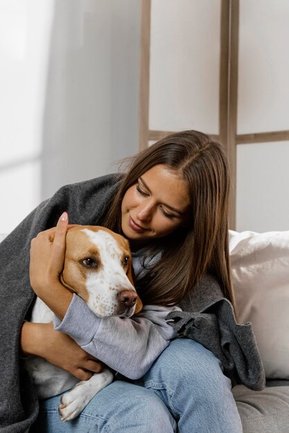 Medium shot teen hugging dog