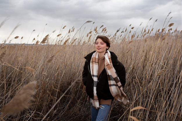 Medium shot teen walking in nature