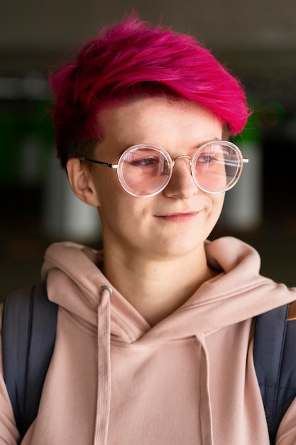 Medium shot teen with cool pink hair