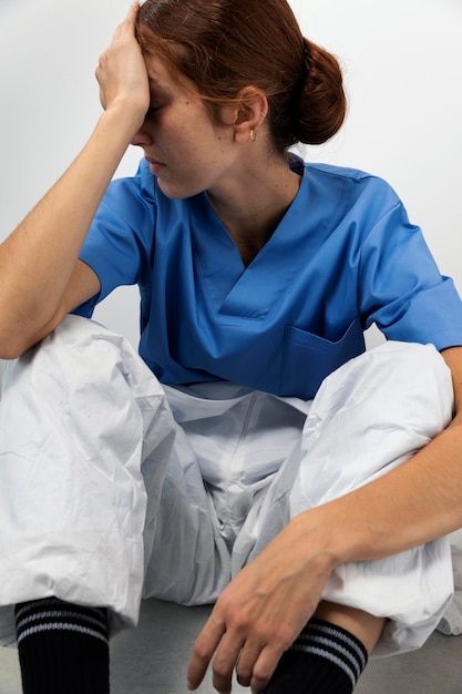 Free Photo medium shot tired woman sitting