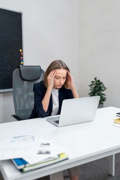 Medium shot tired woman at work