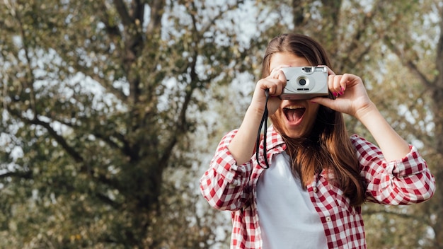 Free Photo medium shot of traveler taking a photo