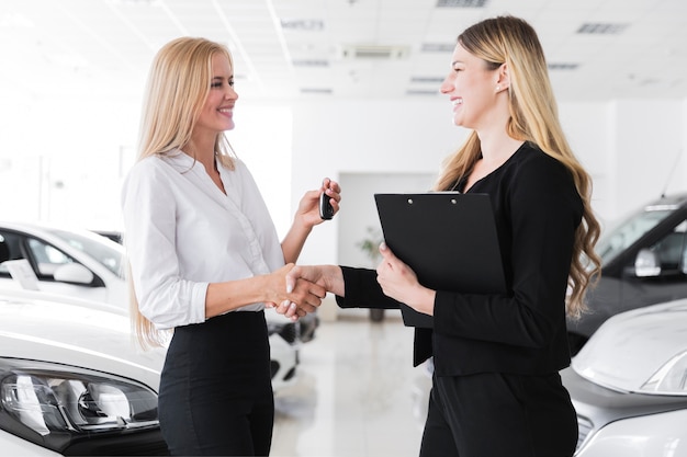 Medium shot of two blonde women looking at each other