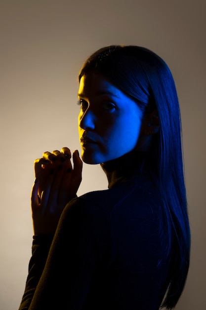 Medium shot unknown woman posing in studio