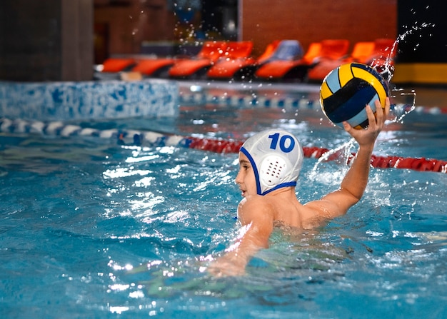 Free photo medium shot waterpolo  player with equipment