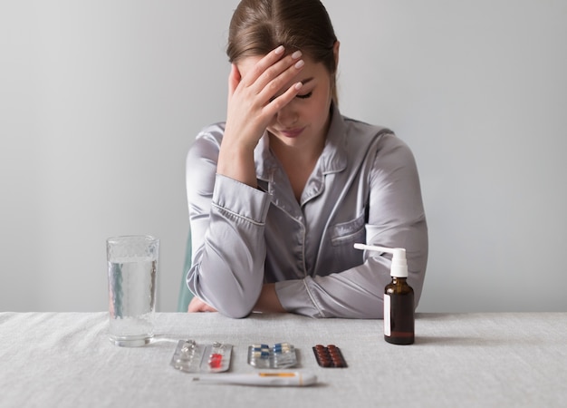 Free photo medium shot woman being sick