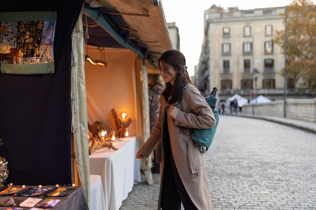 Free photo medium shot woman carrying backpack