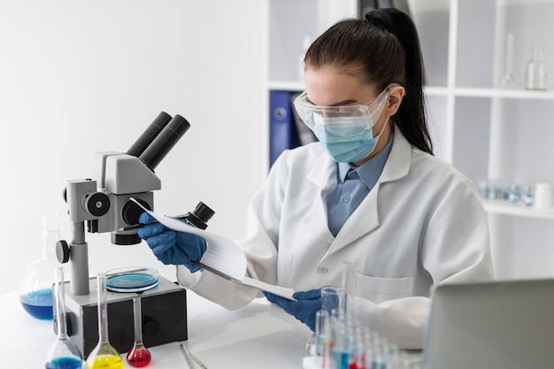 Medium shot woman checking document