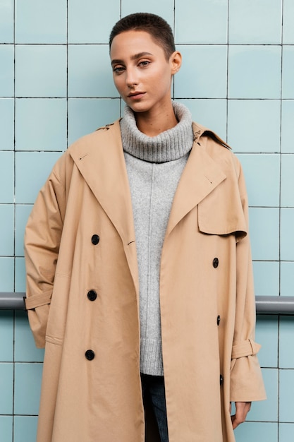 Medium shot woman in coat posing