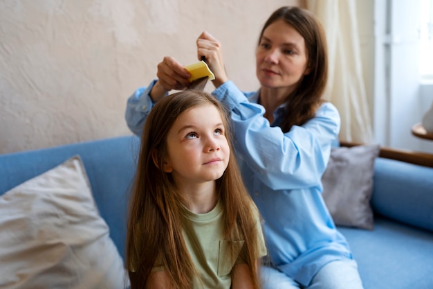 Free photo medium shot woman combing hair