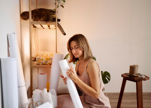 Medium shot woman creating vision board