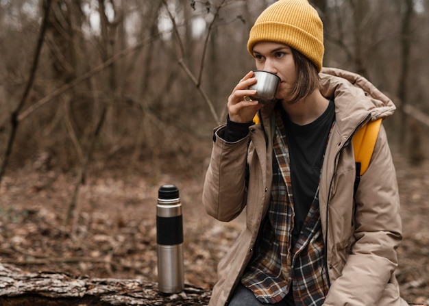 Medium shot woman drinking coffee