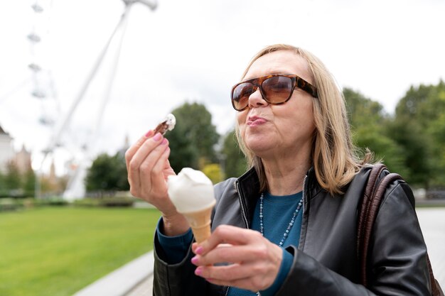 Medium shot woman eating ice cream