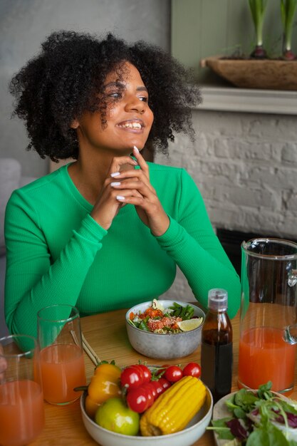 Medium shot woman eating salmon bowl