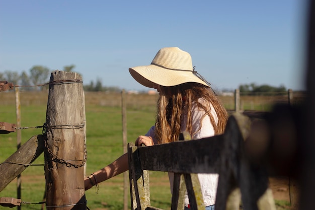 Medium shot woman at farm