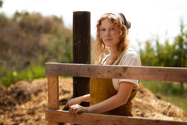 Medium shot woman at farm