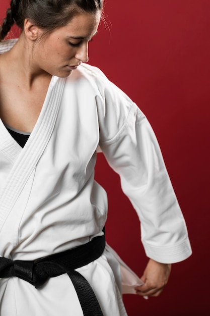 Free photo medium shot of woman fighter fixing her kimono