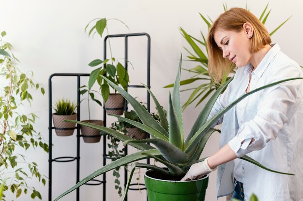 Medium shot woman gardening