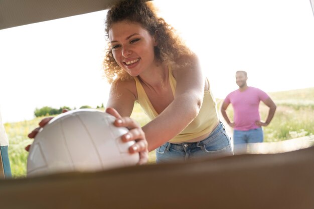 Medium shot woman holding ball