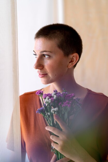 Medium shot woman holding bouquet