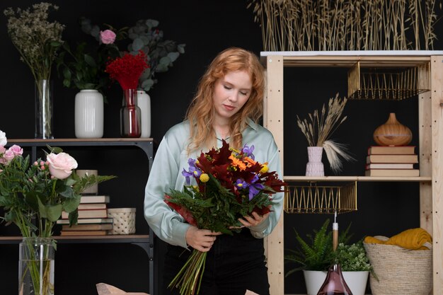 Medium shot woman holding bouquet