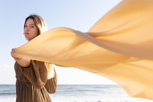 Medium shot woman holding cloth