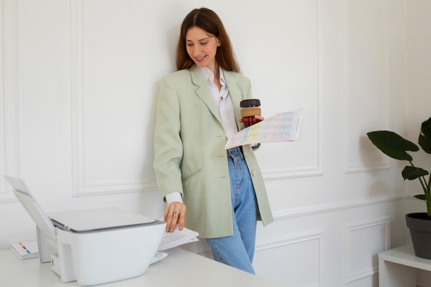 Free Photo medium shot woman holding coffee cup