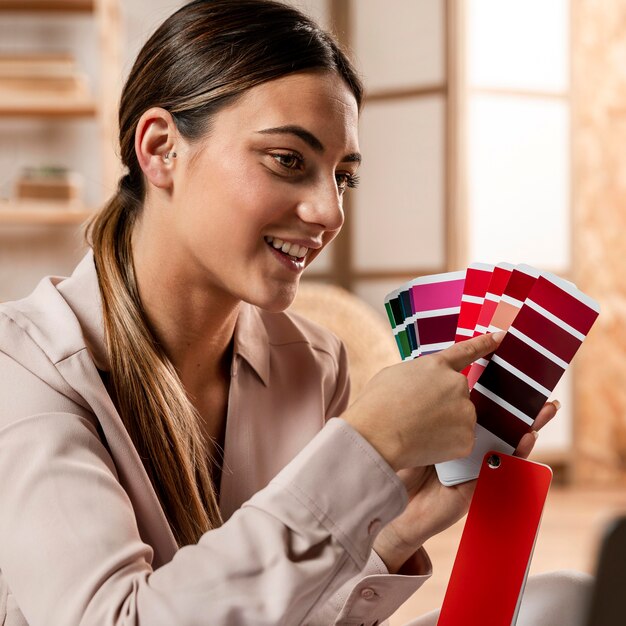 Medium shot woman holding color palette