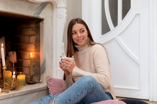 Medium shot woman holding cup