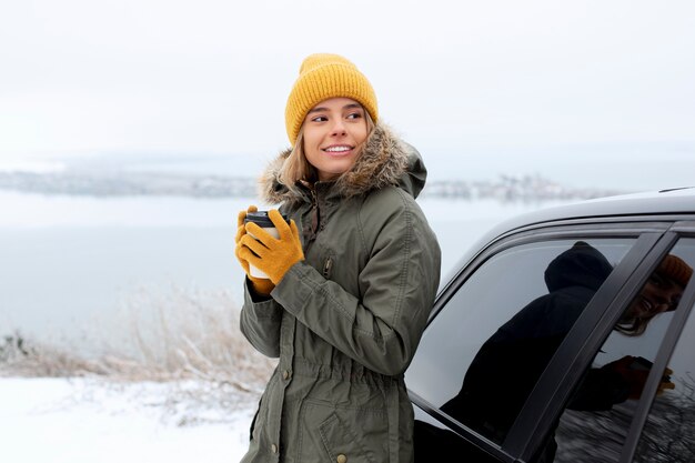 Medium shot woman holding cup