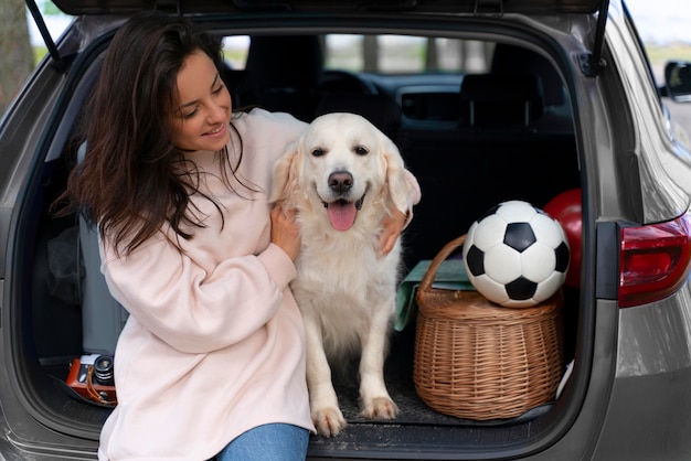 Free Photo medium shot woman holding dog