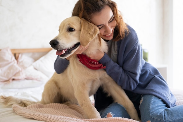 Free Photo medium shot woman holding dog