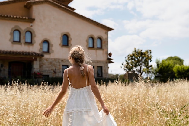 Free photo medium shot woman holding dress