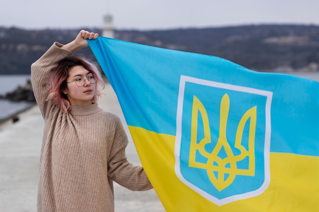 Medium shot woman holding flag