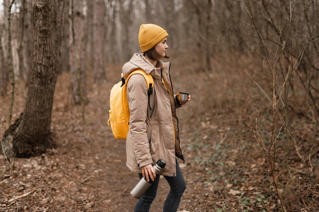 Free Photo medium shot woman holding flask