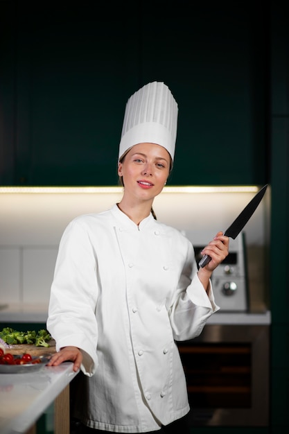 Medium shot woman holding knife