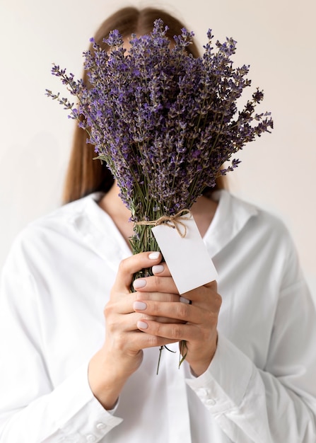 Free Photo medium shot woman holding lavender