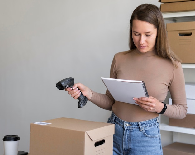 Medium shot woman holding scanner