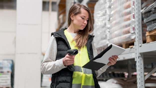 Medium shot woman holding scanning device