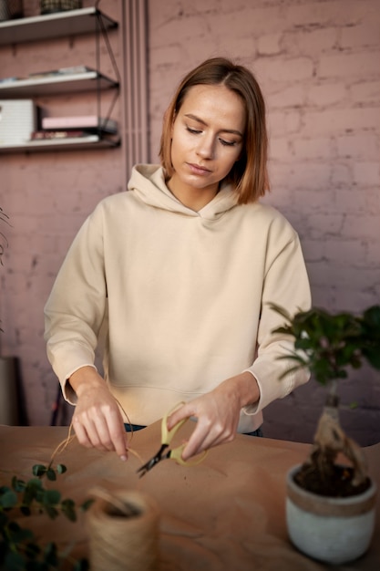 Free Photo medium shot woman holding scissors