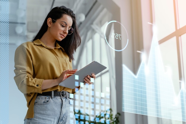 Medium shot woman holding tablet