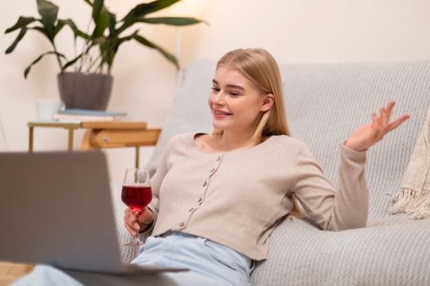 Medium shot woman holding wine