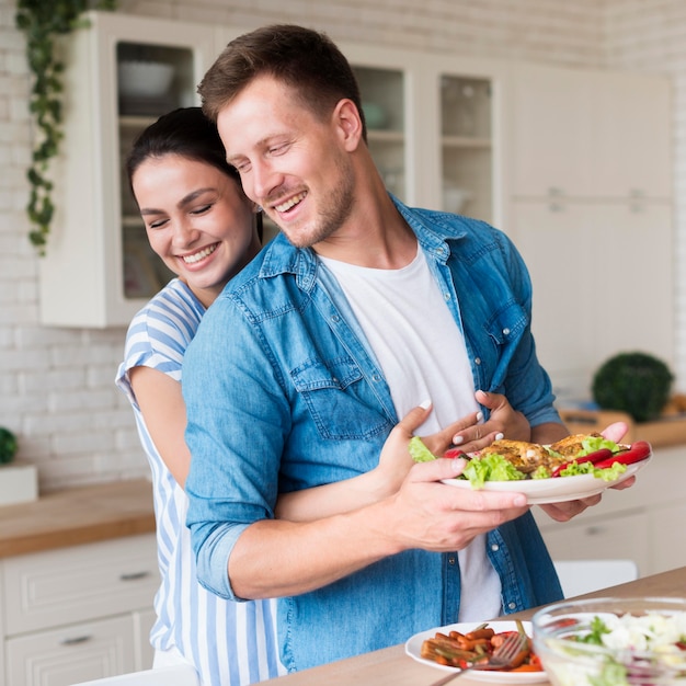 Medium shot woman hugging man