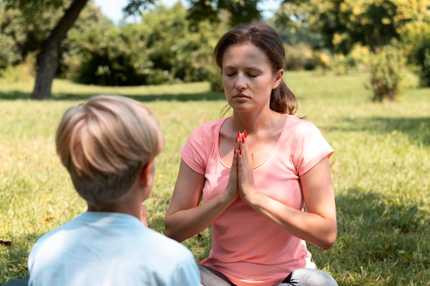 Free Photo medium shot woman and kid outdoors