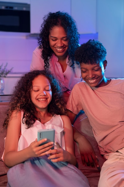 Medium shot woman and kids spending time at home