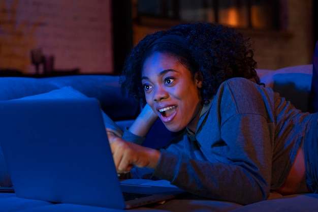 Medium shot woman laying on couch