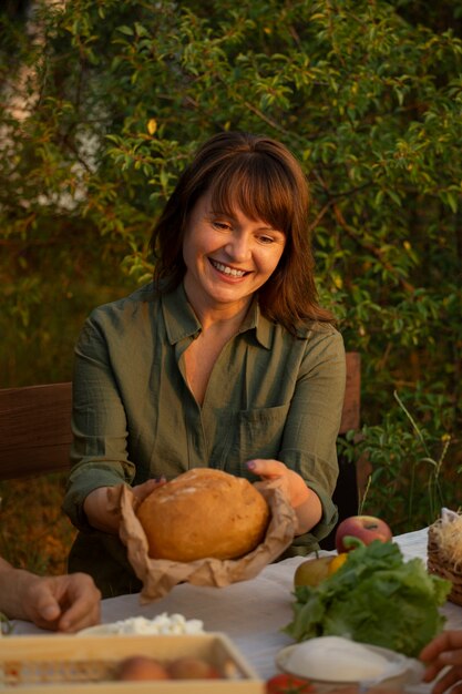 Medium shot woman living at farmhouse