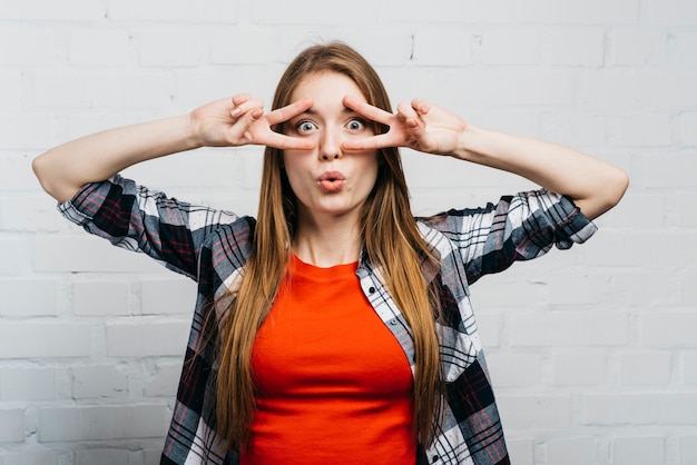 Free Photo medium shot woman making a silly face