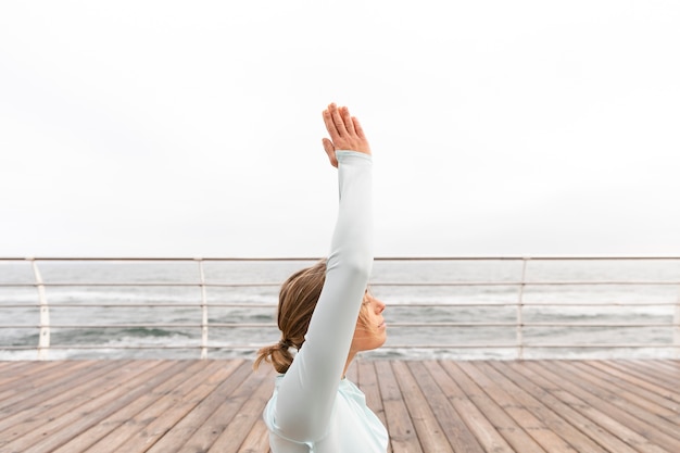 Free photo medium shot woman meditating