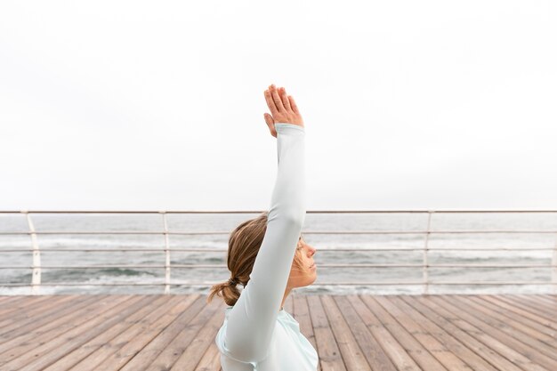 Medium shot woman meditating